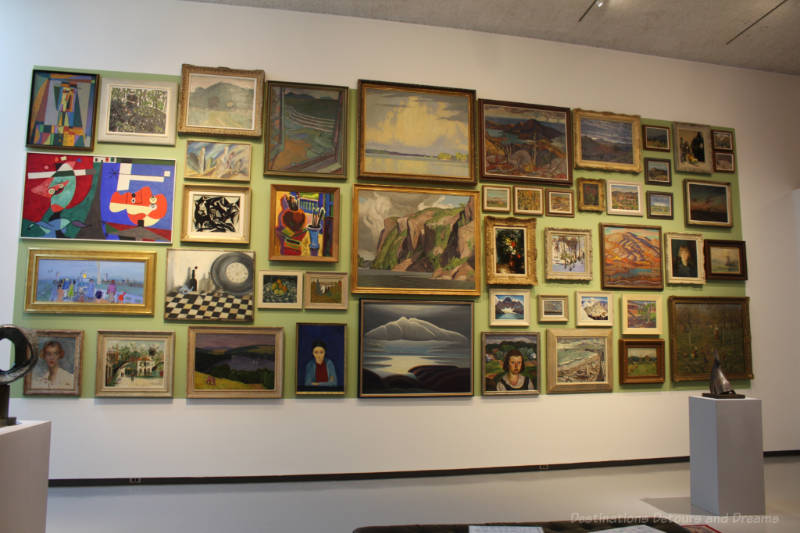 One of the walls in the Winnipeg Art Gallery's Salon Style exhibition covered with paintings close together