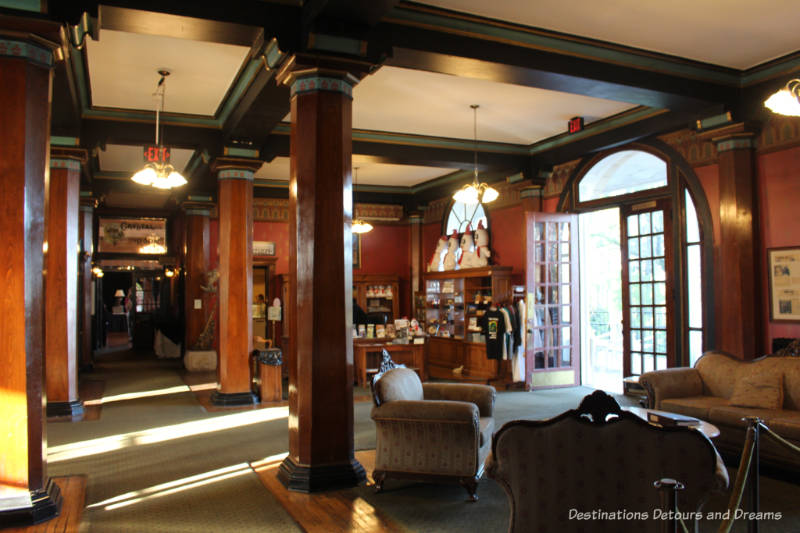 Lobby of Crescent Hotel with period furnishings and dark wood trim