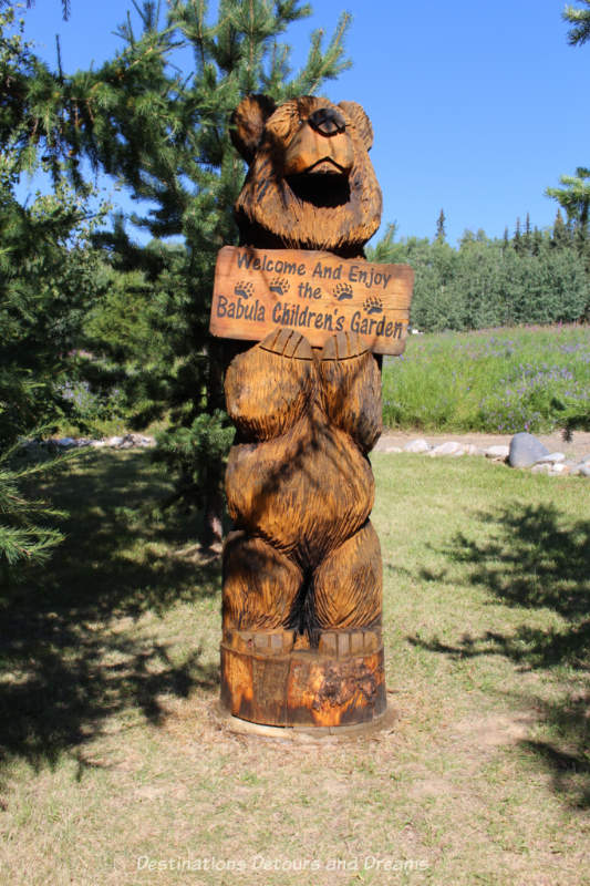 Bear carving welcoming you to the Babula Children's Garden in the Georgeson Botanical Garden in Fairbanks, Alaska