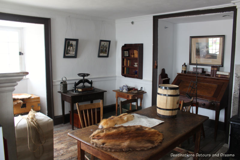 Main room with table and desk of the fur trad e manager's office and residence at Lower Fort garry