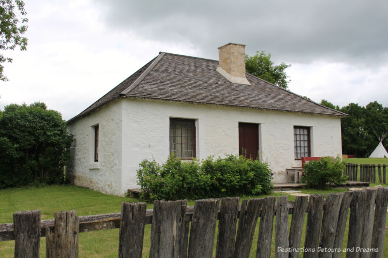 White cottage used to house guests at Lower Fort Garry