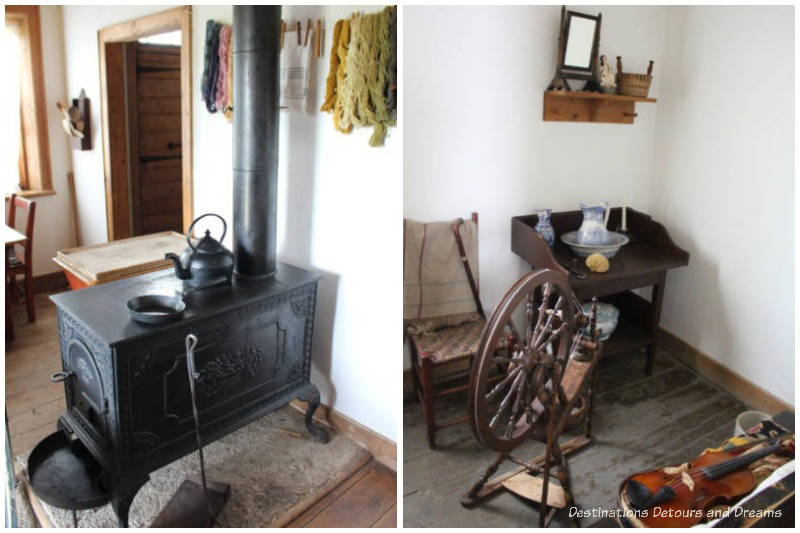 Black stove in kitchen area and spinning wheel and chair in sitting room of farm manager's house at Lower Fort Garry