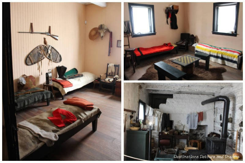 Cots in main room and kitchen area of Men's House at Lower Fort Garry