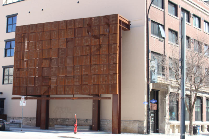 Billboard-style public art piece made of weathering steel in Winnipeg's East Exchange District commemorating the 1919 General Strike