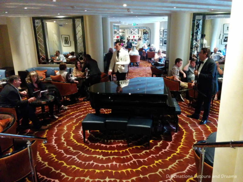 Grand piano in the centre of the room at the American Bar in London's Savoy Hotel