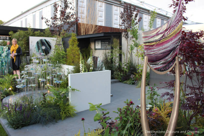 Display of glass art by Carrie Anne Funnell amid plantings at the 2019 Chelsea Flower Shower