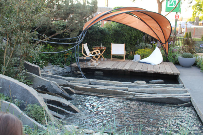 Wooden patio area over water in the Facebook Garden: Beyond the Screen at the 2019 Chelsea Flower Show