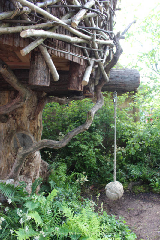 Treehouse and swing at the RHS Back to Nature Garden at the 2019 Chelse Flower Show