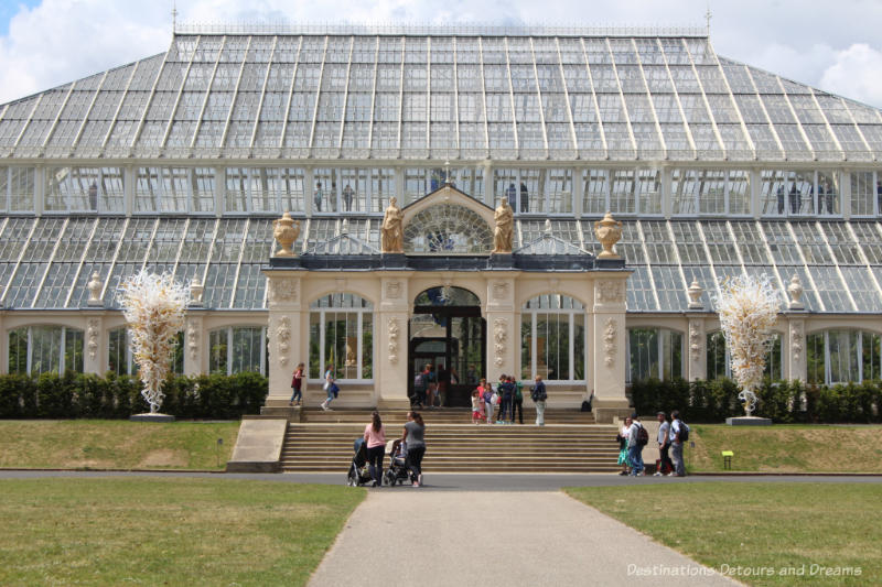 The Temperate House at Kew Gardens with identical Chihuly sculptures one either side of the enrance