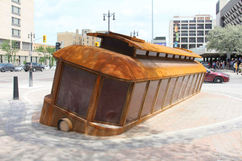 Tilted streetcar sculpture in Winnipeg, Manitoba