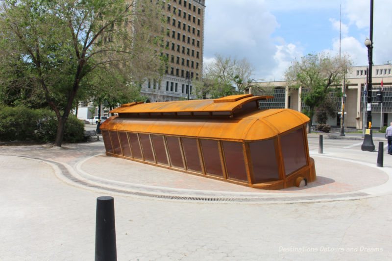 Bloody Saturday sculpture in Winnipeg, Manitoba: a tilted streetcar remembering the violent events of Bloody Saturday in the 1919 Winnipeg General Strike