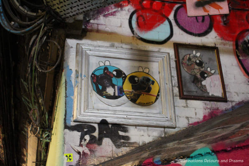 Graffiti art in a picture frame in Leake Street Tunnel