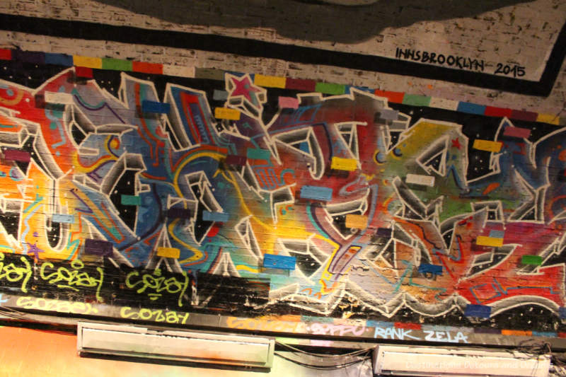 Geometric graffiti on wall of London Leake Street Tunnel