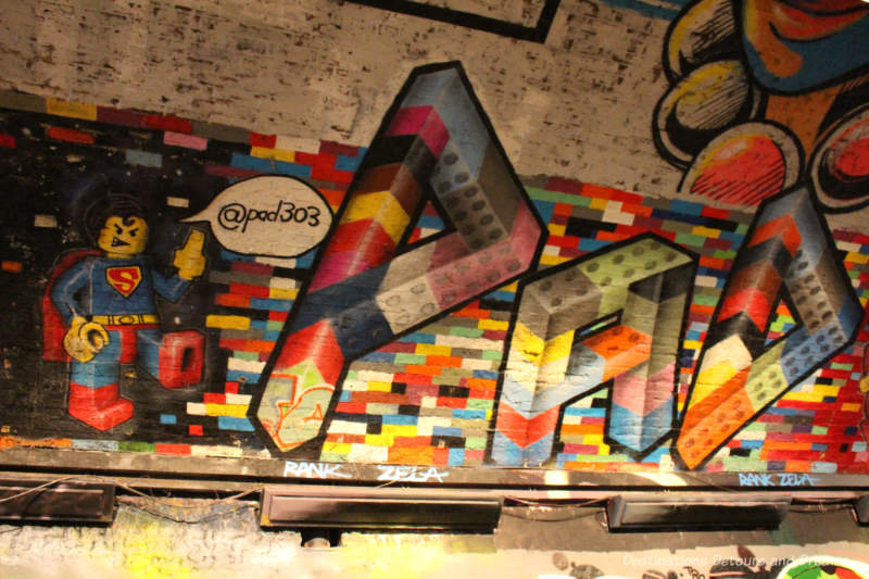 London Graffiti Tunnel: Lego Superman Lego Superman painted on wall of London Leake Street Tunnel