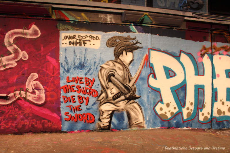 Graffiti painting in London Leake Street Tunnel