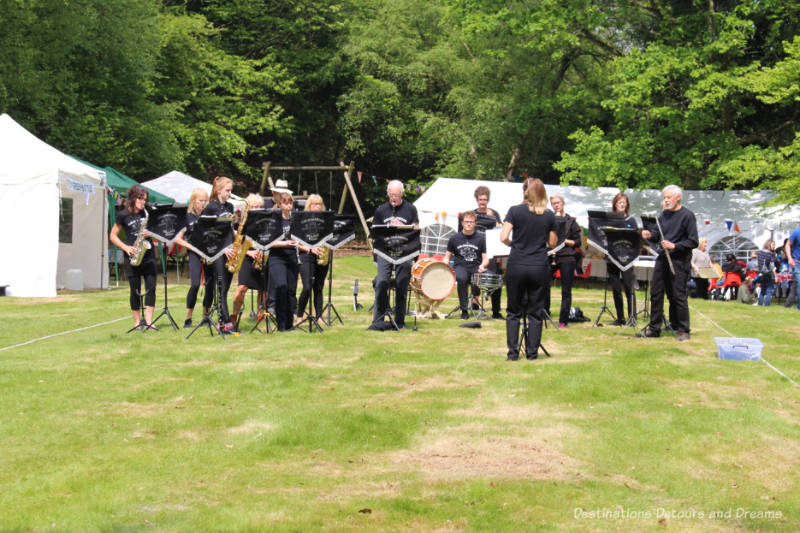 Village band playing in the centre of the square at an English village fête