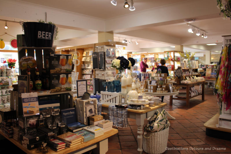 Tables and shelves of goods inside Denbies Wine Estate Gift Shop