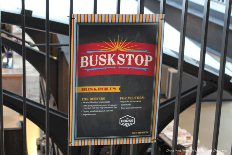 Buskstop sign indicating a place at The Forks to find street performers