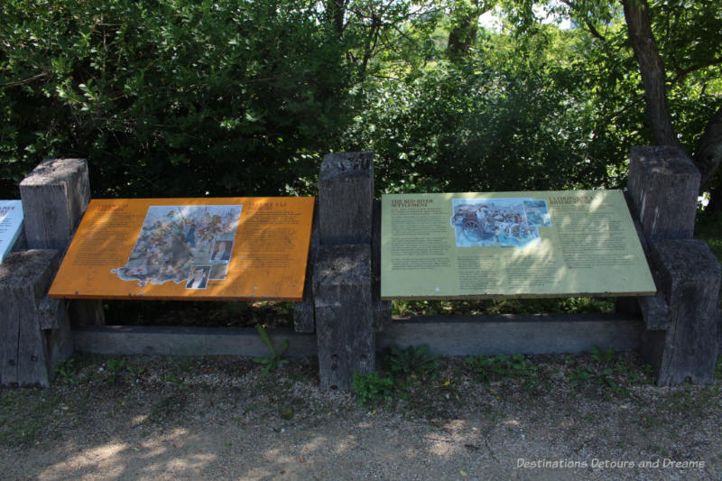 Signpost in front of trees at the Forks National Historic Site