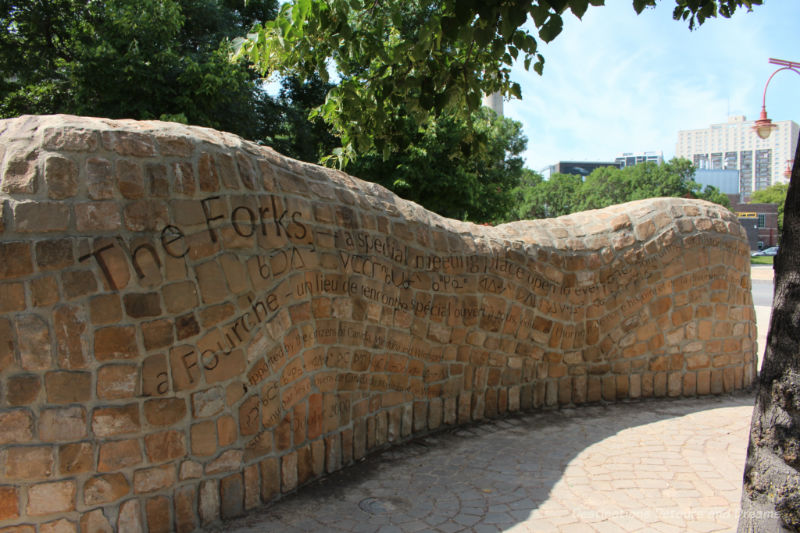 Stone wall with The Forks mission on it