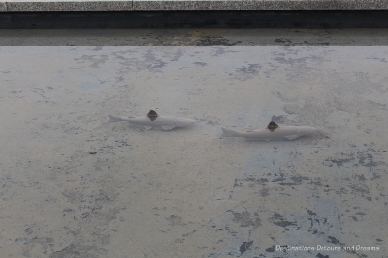 Fish statues inside a water feature at the Aga Khan Garden at the University of Alberta Botanic Garden