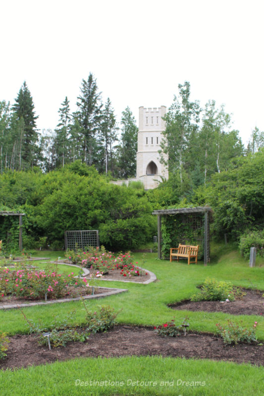 Folly tower of Manitoba Tyndall stone behind the Rose Garden at University of Alberta Botanic Garden