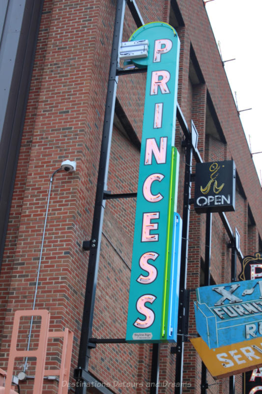 Vertical neon sign with PRINCESS written on it at the Edmonton Neon Museum 