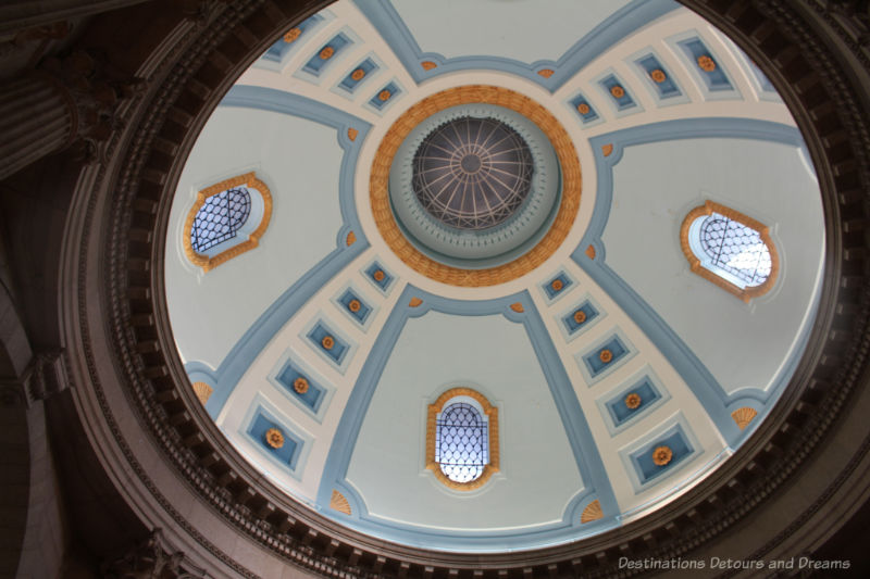 The blue and gold painted interior dome of the Manitoba Legislative Building