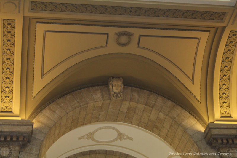 Carved figure of Medusa in recessed wall area at the Manitoba Legislative Building