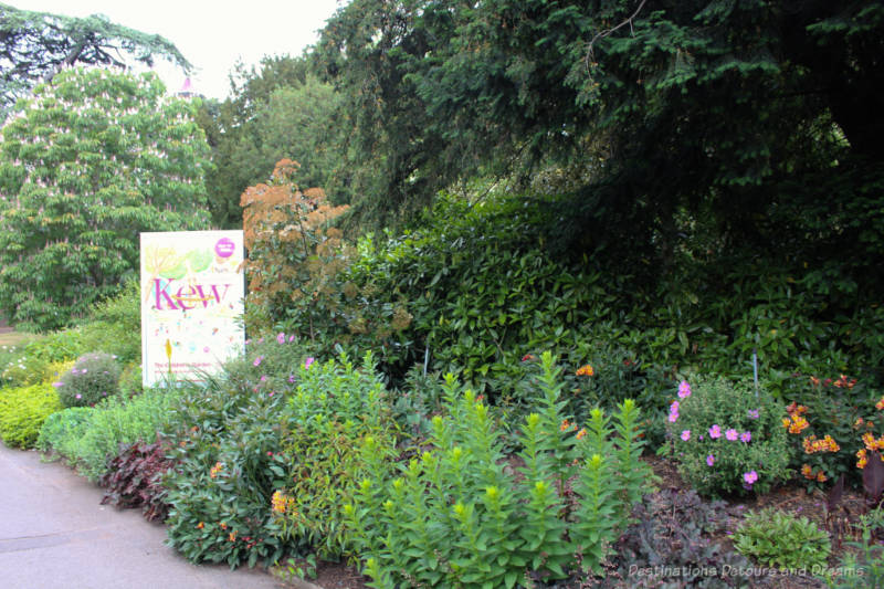 Flowers and trees at one of the entrances to Kew Gardens in London