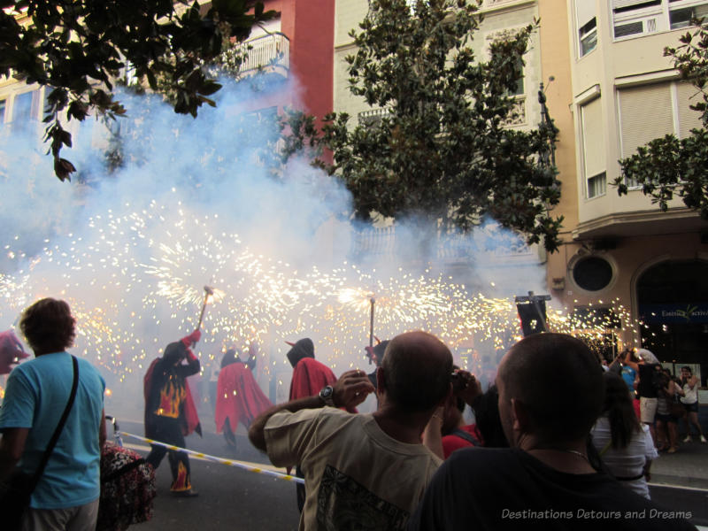 Correfoc (fire run) at Gracia Street Festival parade