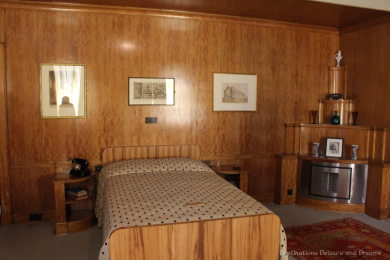 Art deco masculine bedroom with wood walls at Eltham Palace