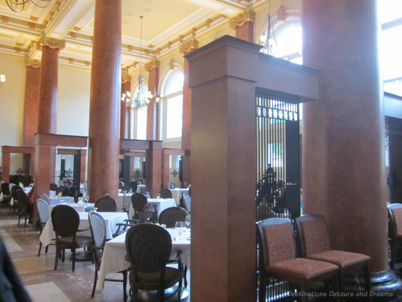 Elegant dining room of Janes Restaurant with marble pillars and floor