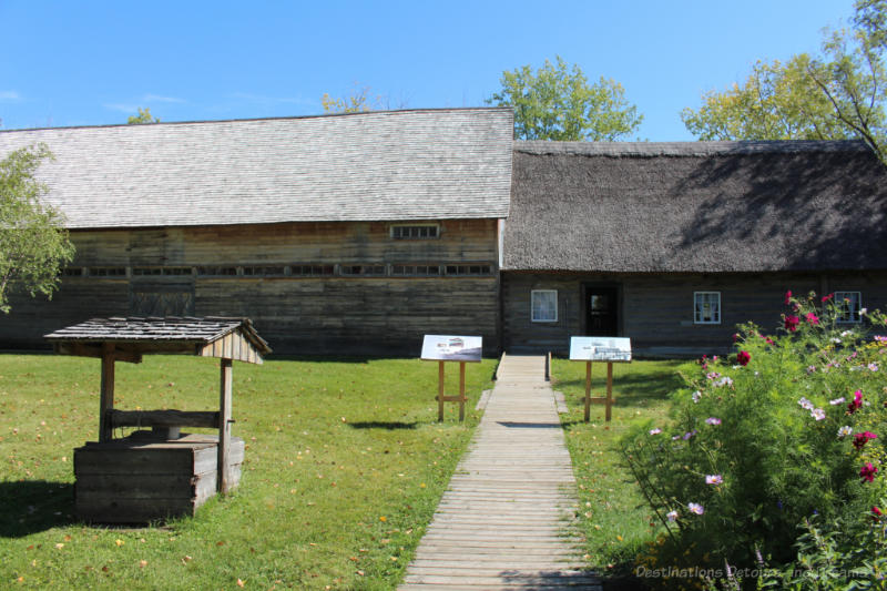 Wood housebarn - house with thatched roof and attached barn