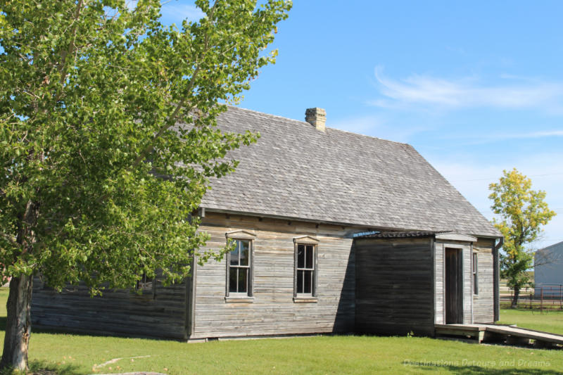 Grey wood school building from 1885