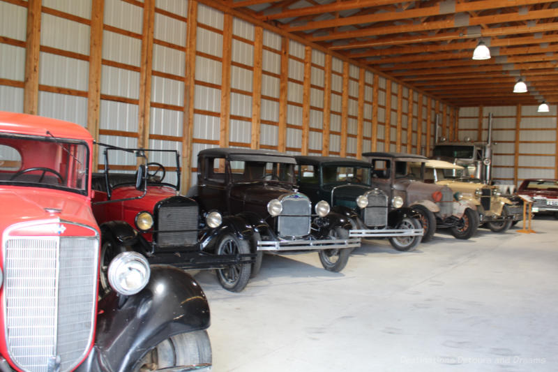 A collection of old cars on display at Mennonite Heritage Village