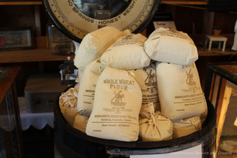 Small cloth bags of mill-ground flour for sale