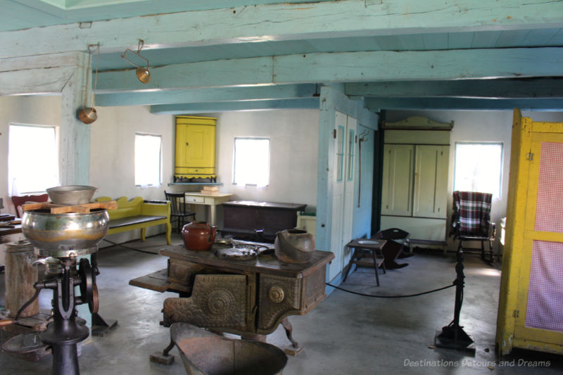 Basic furnishings in an open area of a wooden 1880s house at the Mennonite Heritage Village