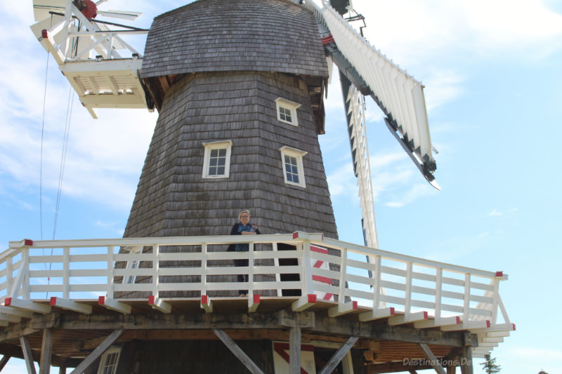 Women on second level balcony of wooden windmill