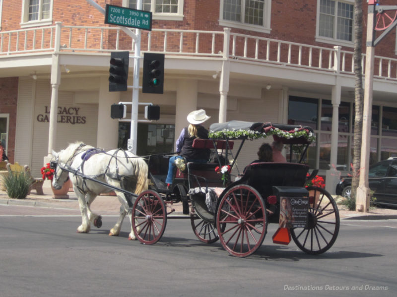 Horse and carriage driving through Old Town Scottsdale