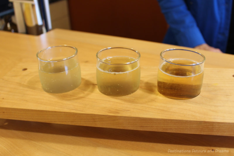 Three glasses of cider in a tasting flight at Ciderworks