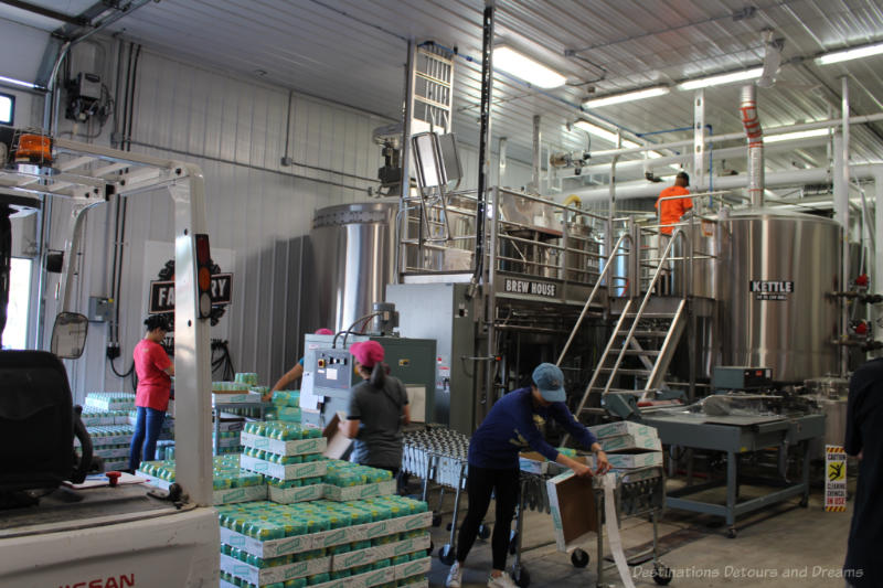 People working inside a brewery