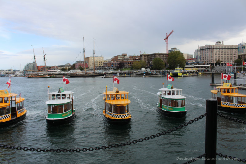 Five Victoria Harbour Ferry boats lined up at the end of the water ballet performance