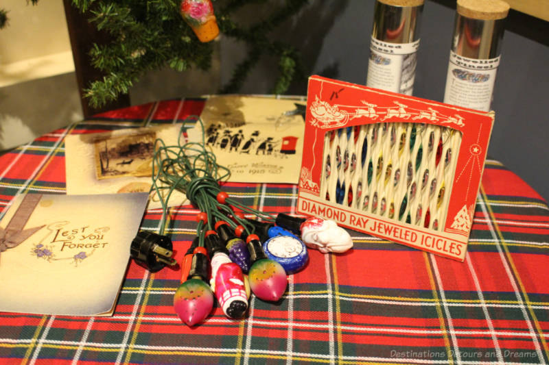 A table display of Christmas tree decorations from the 1920s and 1930s