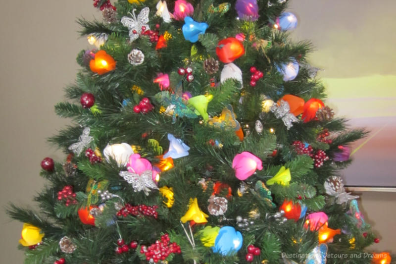 Various coloured lights and other decorations on a Christmas tree