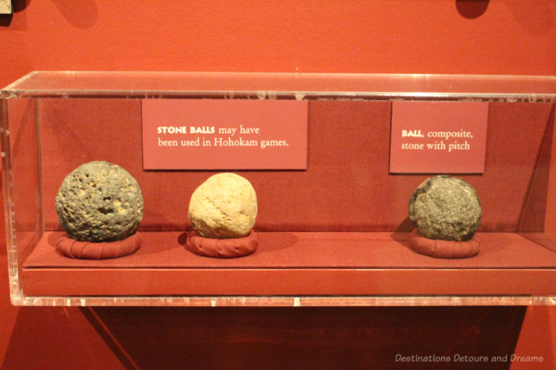 Display of three stone balls used in Hohokam games