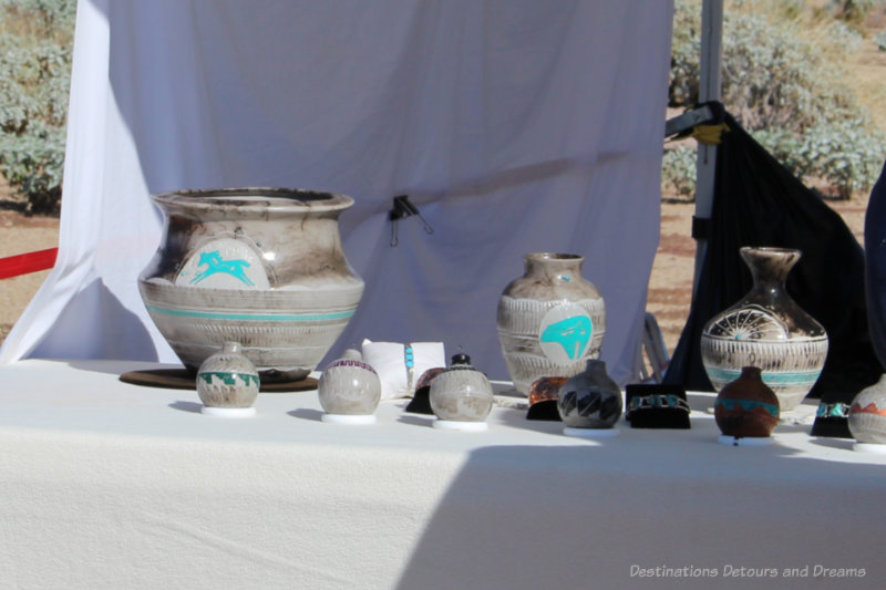 A collection of Indian pottery with turquoise decorations at an Indian market