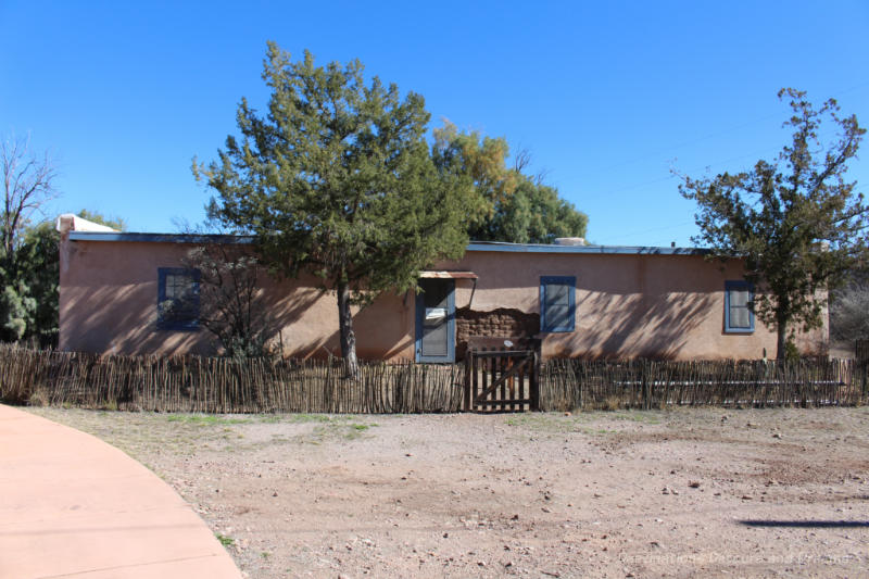 Adobe vernacular row house with blue trim at Tubac Presidio State Historic Park