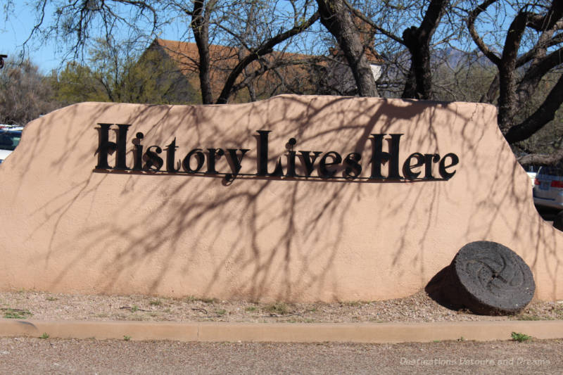 History Lives Here sign on rock at entrance to Tubac Presidio State Historic Park