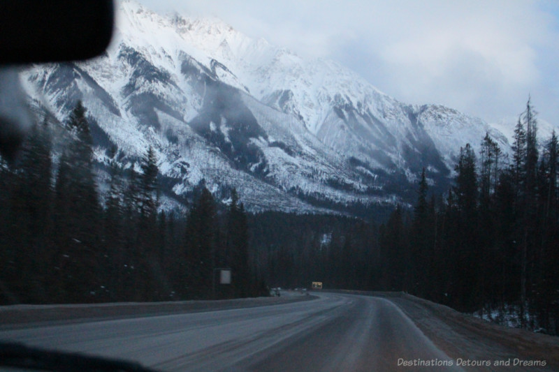 Bluish looking snow-covered mountains in British Columbia at nightfall